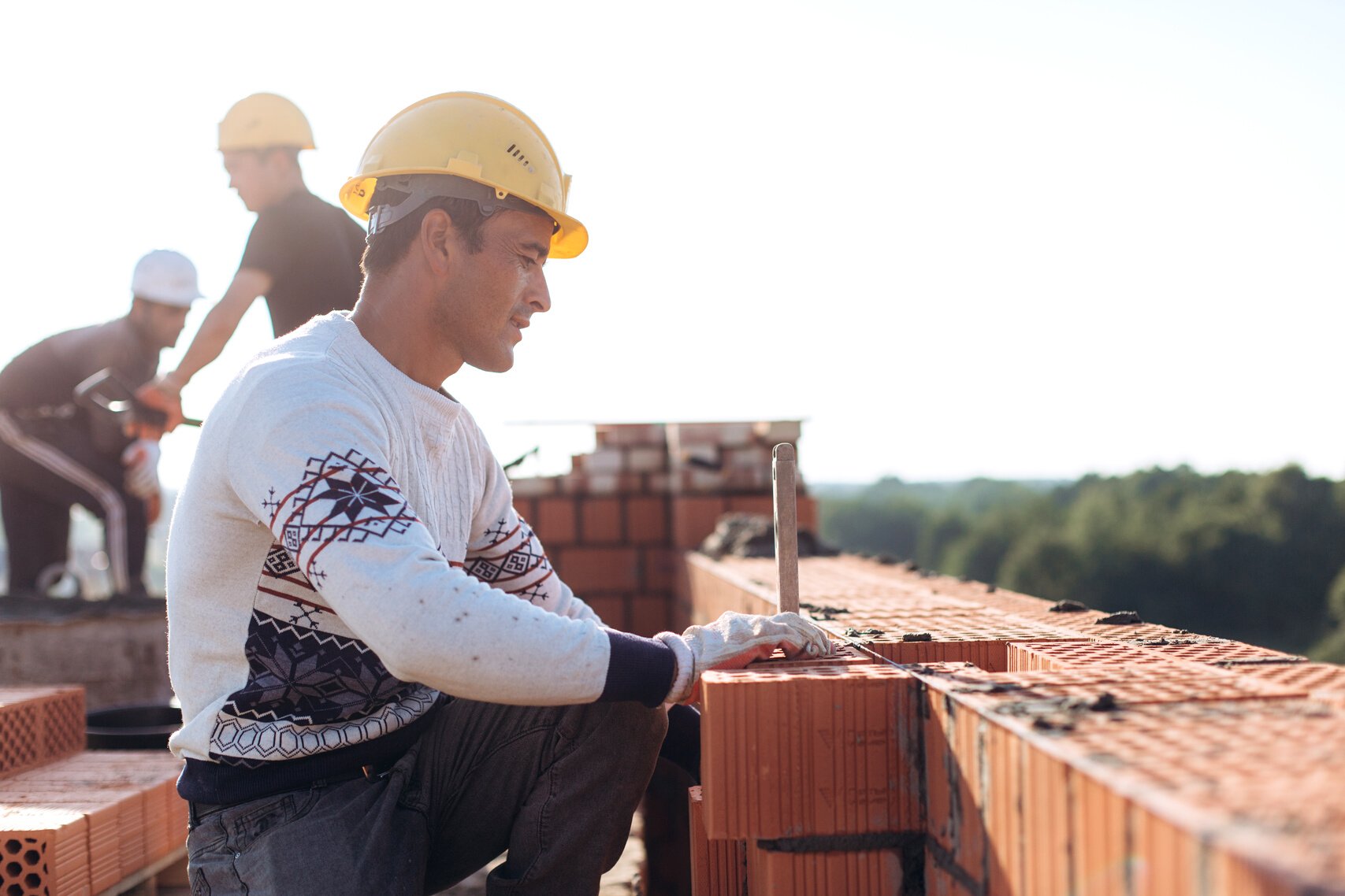 Brick Workers at Construction Site